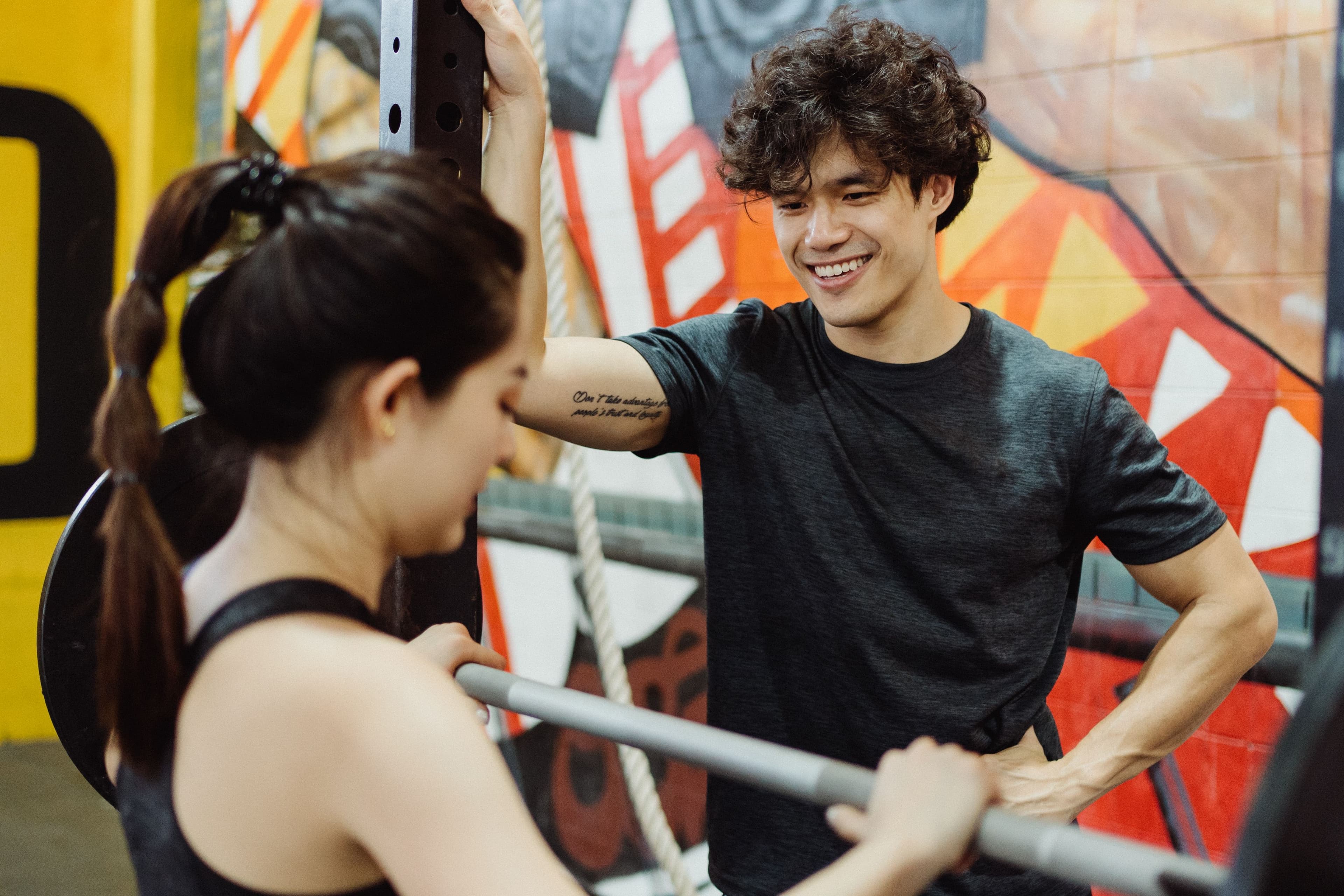 A coach guiding a strength-training session